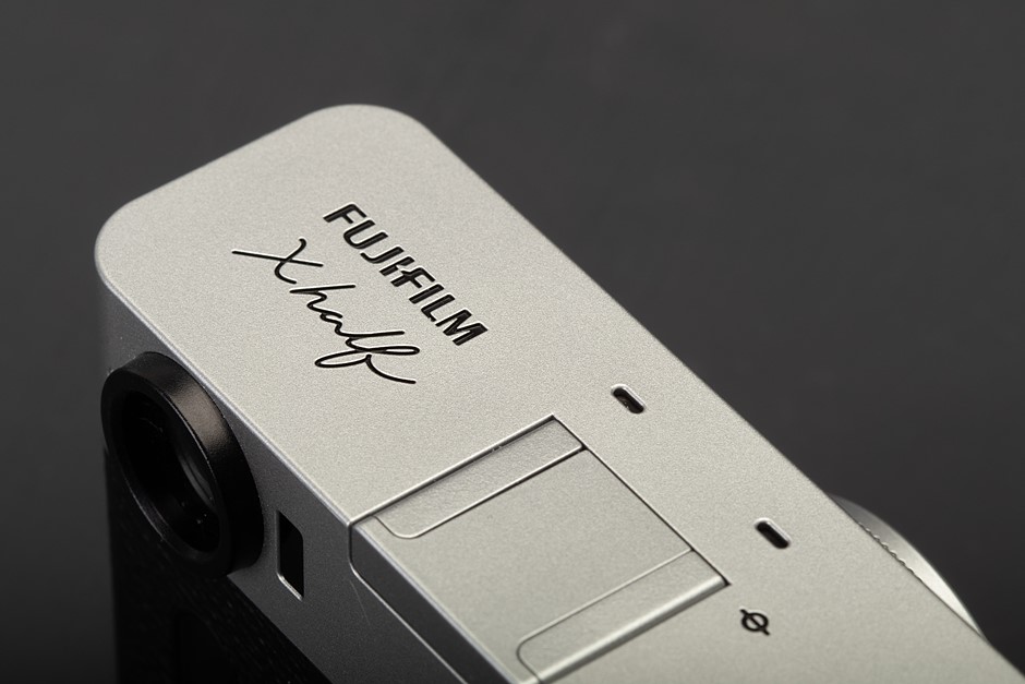 Fujifilm X Half logo on a camera body