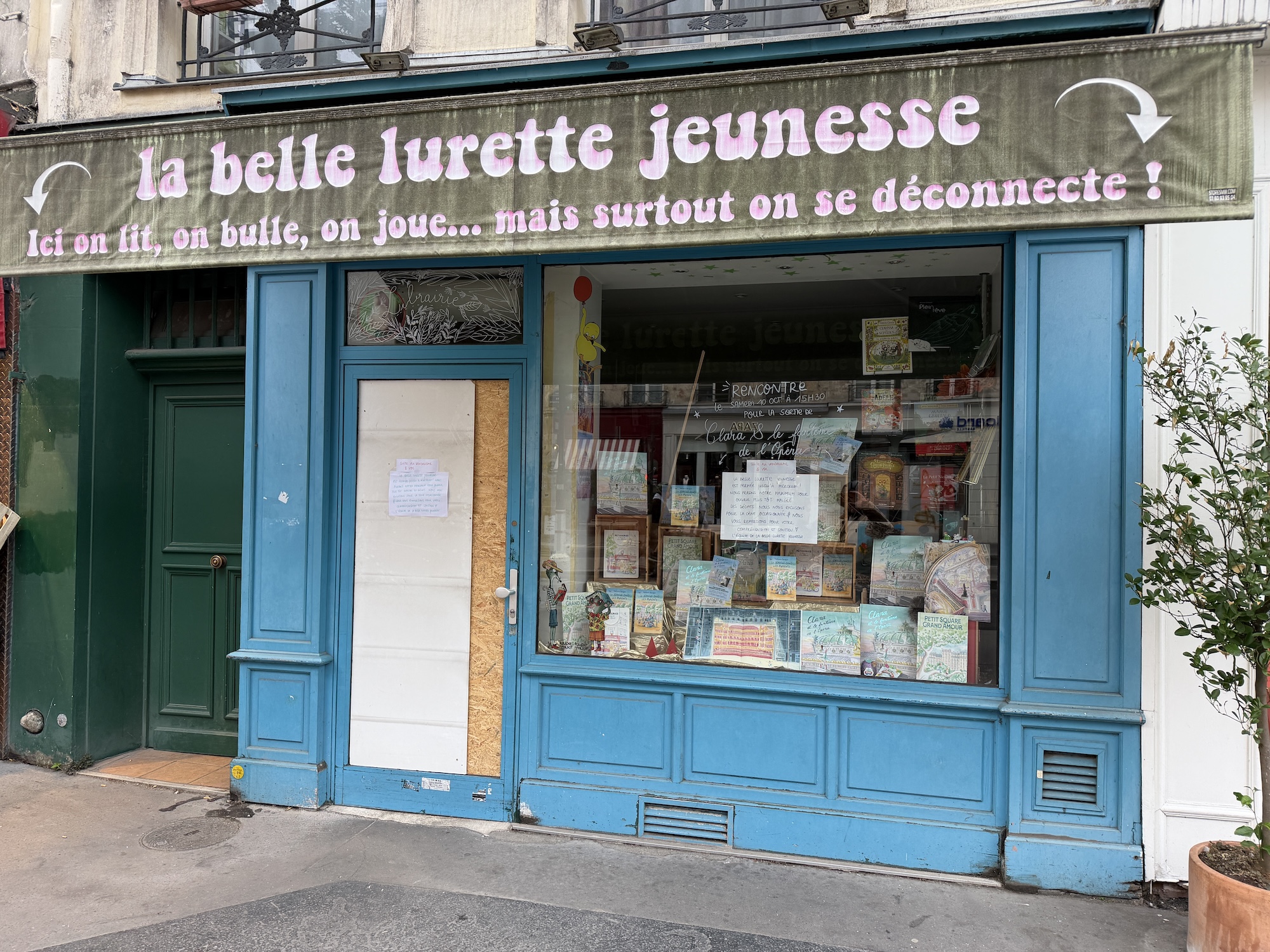 Vandalized bookshop front in France following October protests