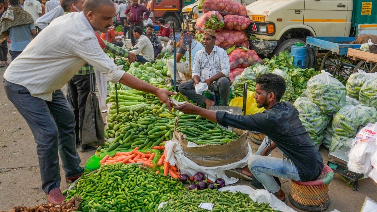 Vegetable stall reflecting festive-season price rise in tomatoes, onions and greens