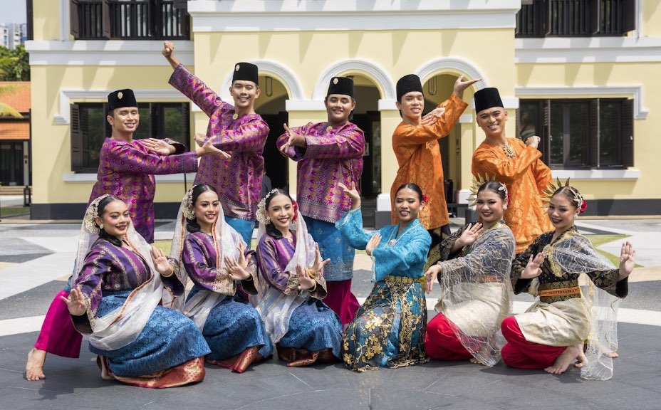 Zapin dancers performing in traditional attire during a cultural showcase