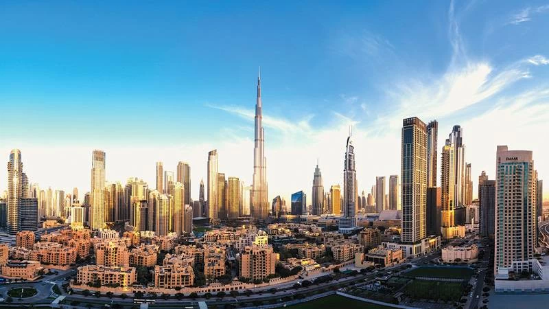 Dubai skyline with transaction data visualization showing AED 574 billion in property deals over nine months of 2026