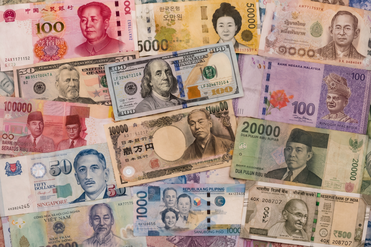 Asian currencies weaken after hot US inflation