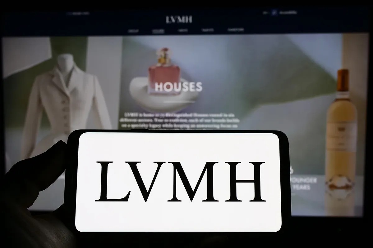 LVMH Group logo displayed on a smartphone held by a person