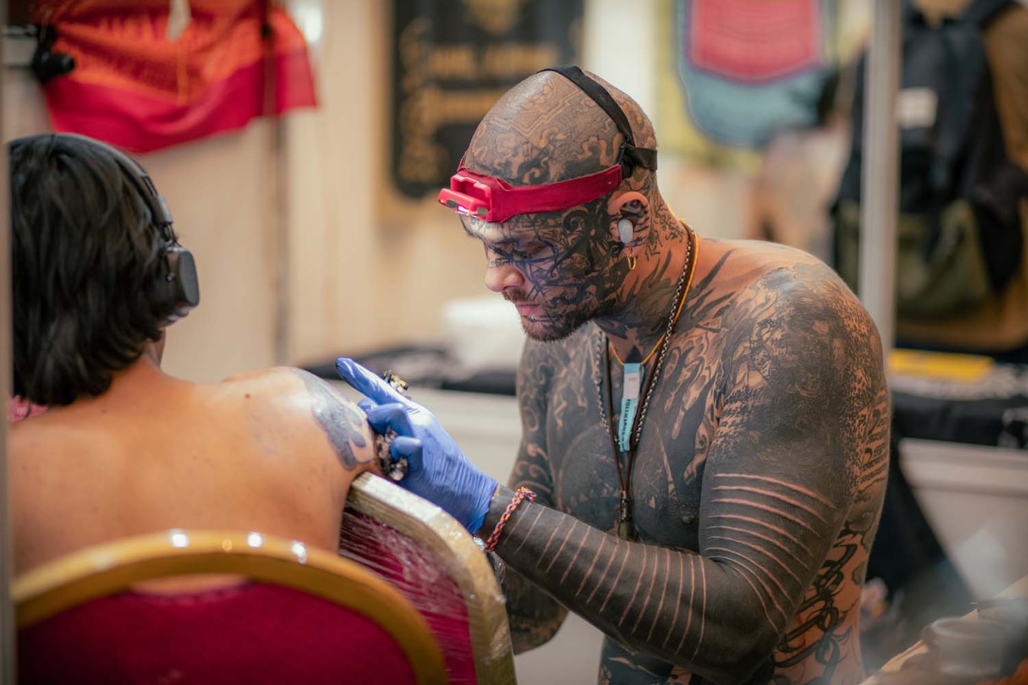 Artists at the 13th International Nepal Tattoo Convention blending traditional deities with modern tattoo styles