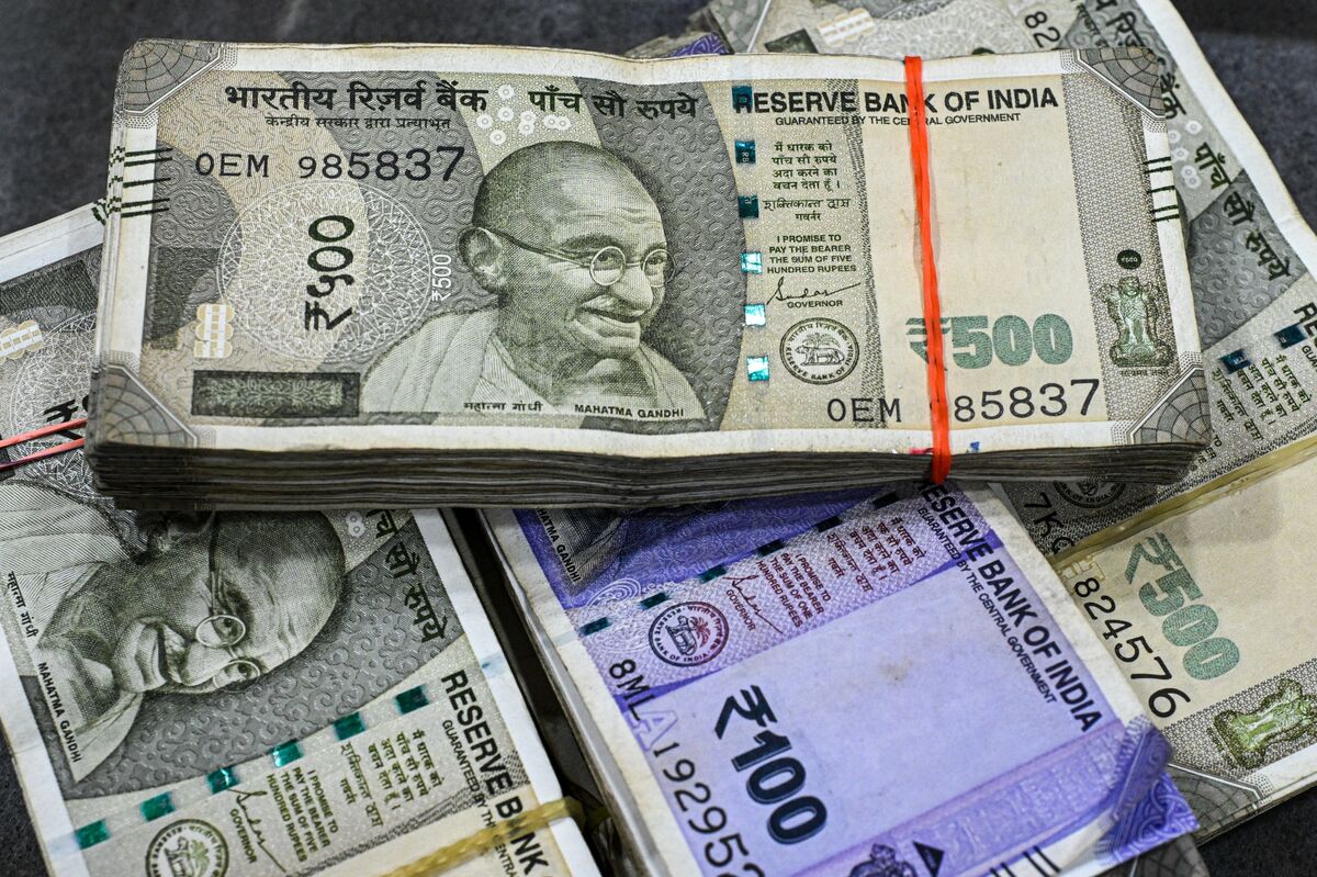 Rupee currency notes and RBI logo