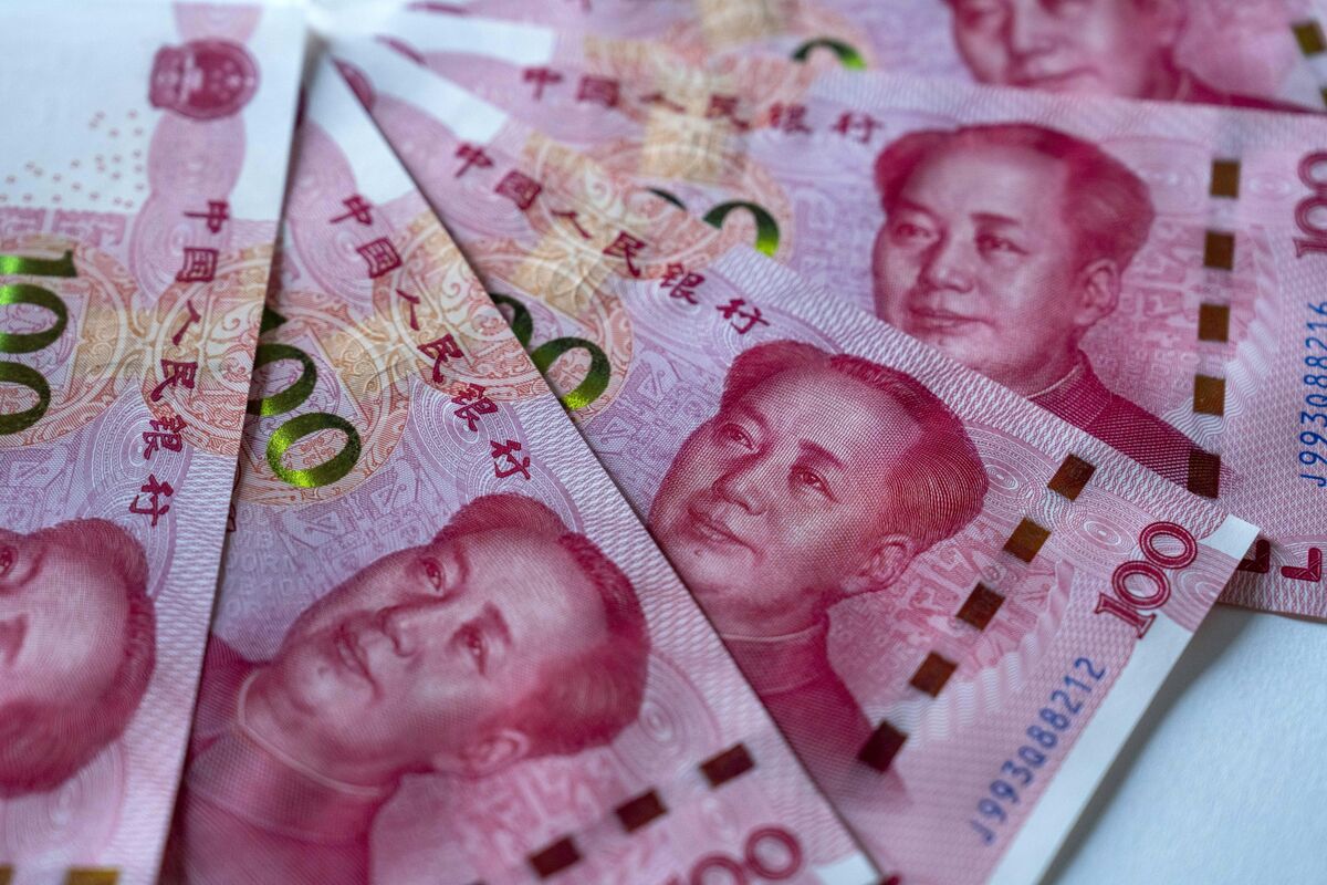 Yuan symbol alongside global financial charts