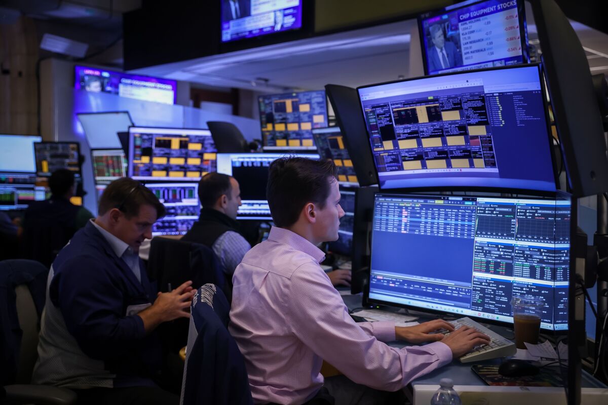 Traders reacting to market moves at a financial center