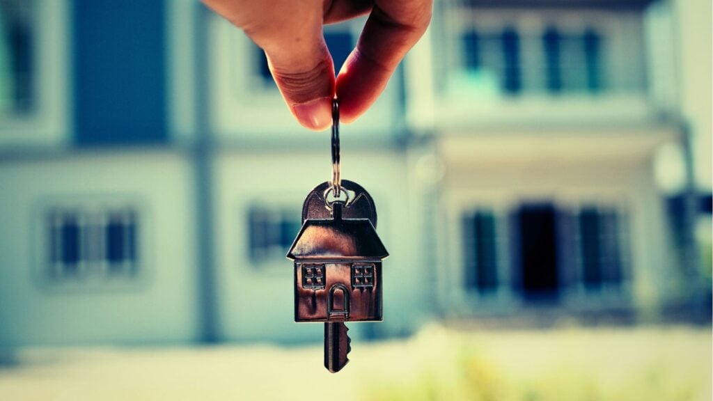 Real estate agent showing a house to buyers