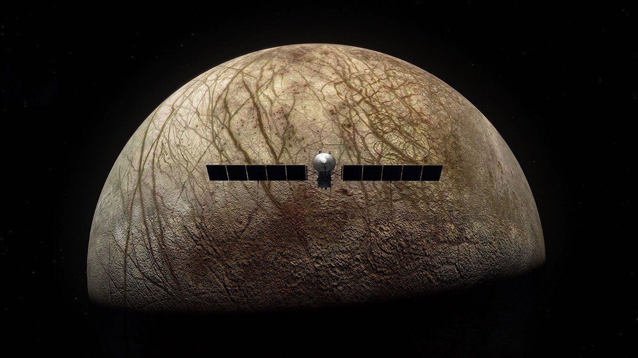 Europa Clipper mission concept art showing the spacecraft during a Europa flyby near Jupiter