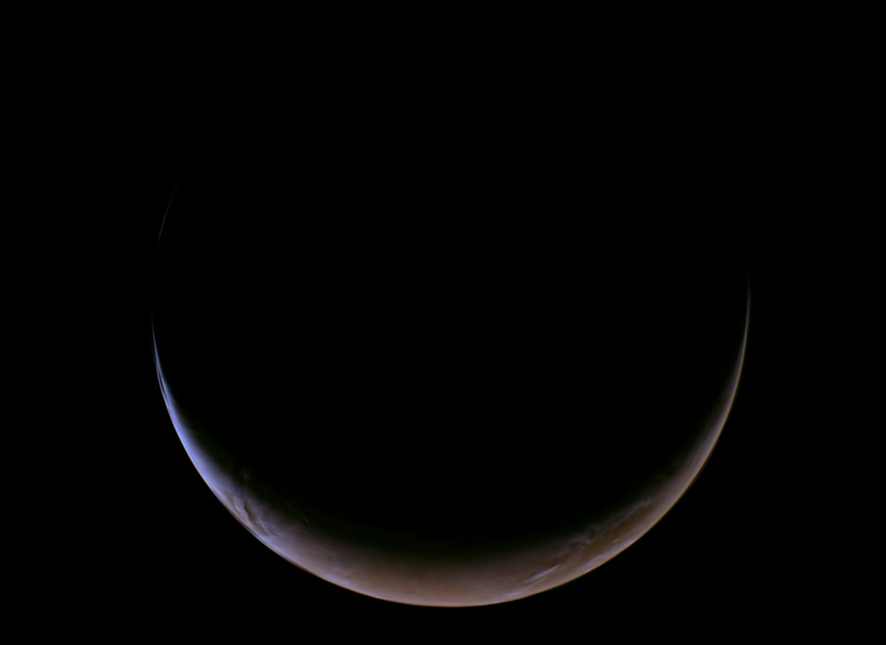 NASA's Psyche spacecraft captured this close-up view of a crescent Mars during its May 15 gravity-assist flyby