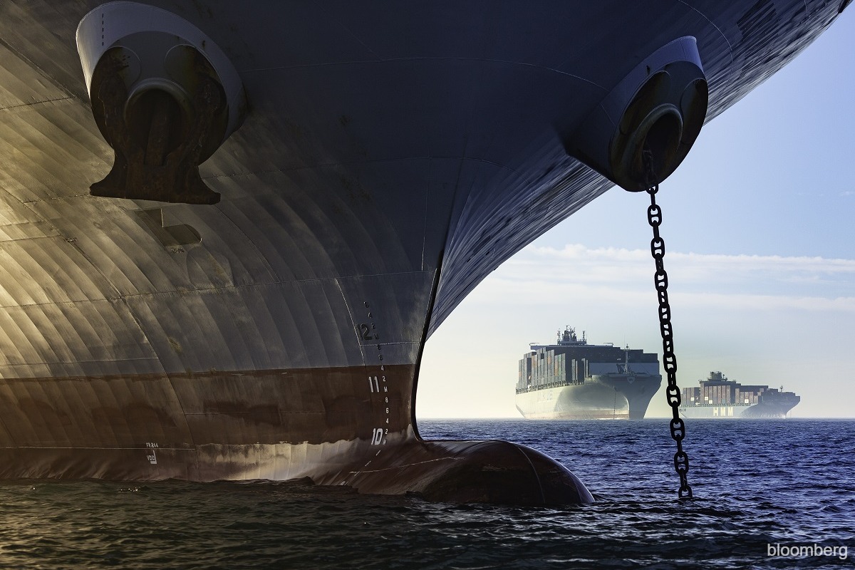 Container ships queue at a busy Asian port amid ongoing congestion