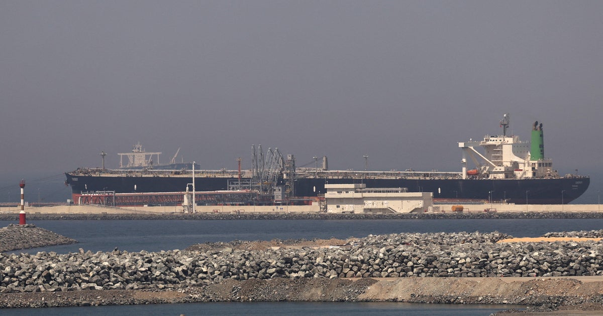 CBS News footage showing tankers anchored off Fujairah, UAE, and conditions in the Strait of Hormuz.