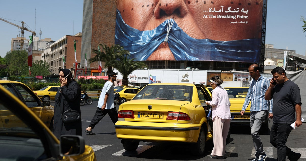 A billboard in Iran reflecting the standoff between Tehran and Washington — Iran is tightening Hormuz controls as peace talks collapse