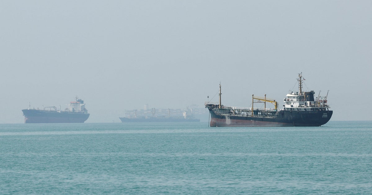 CBS News live update on U.S.-Iran Strait of Hormuz standoff, showing ships near the strait