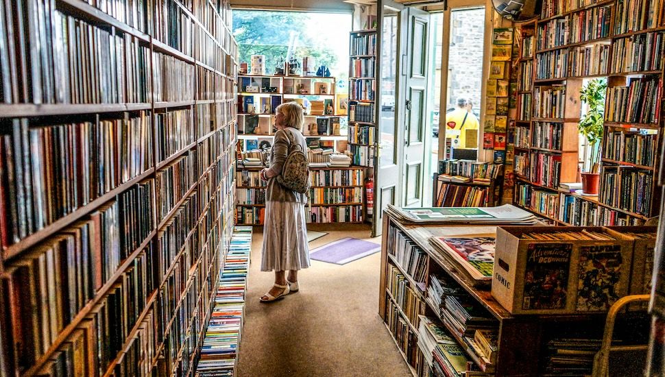 Bookstore shelves with recent bestselling titles displayed