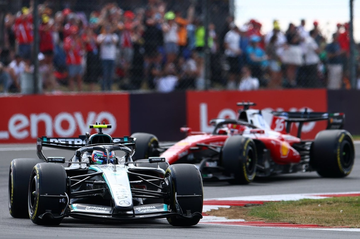George Russell's Mercedes in close pursuit of the Ferrari during Sunday's Grand Prix