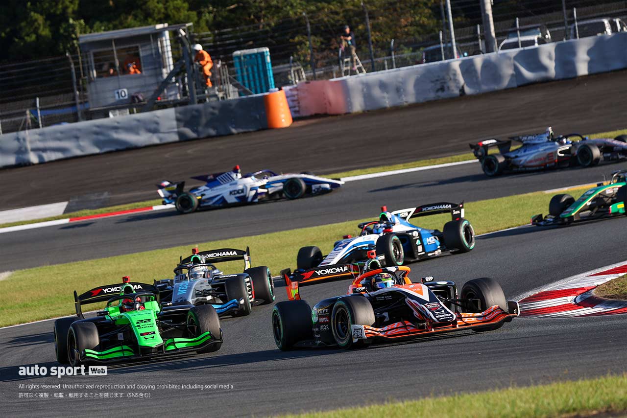 Super Formula cars racing at Fuji Speedway