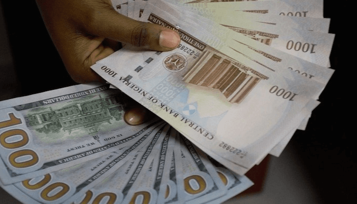 Nigerian naira notes and US dollar bills on a table