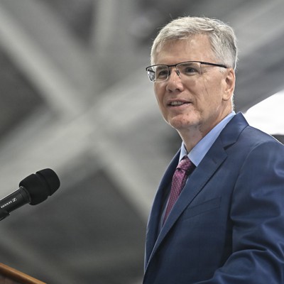 Secretary of the Air Force Troy Meink speaking at a conference