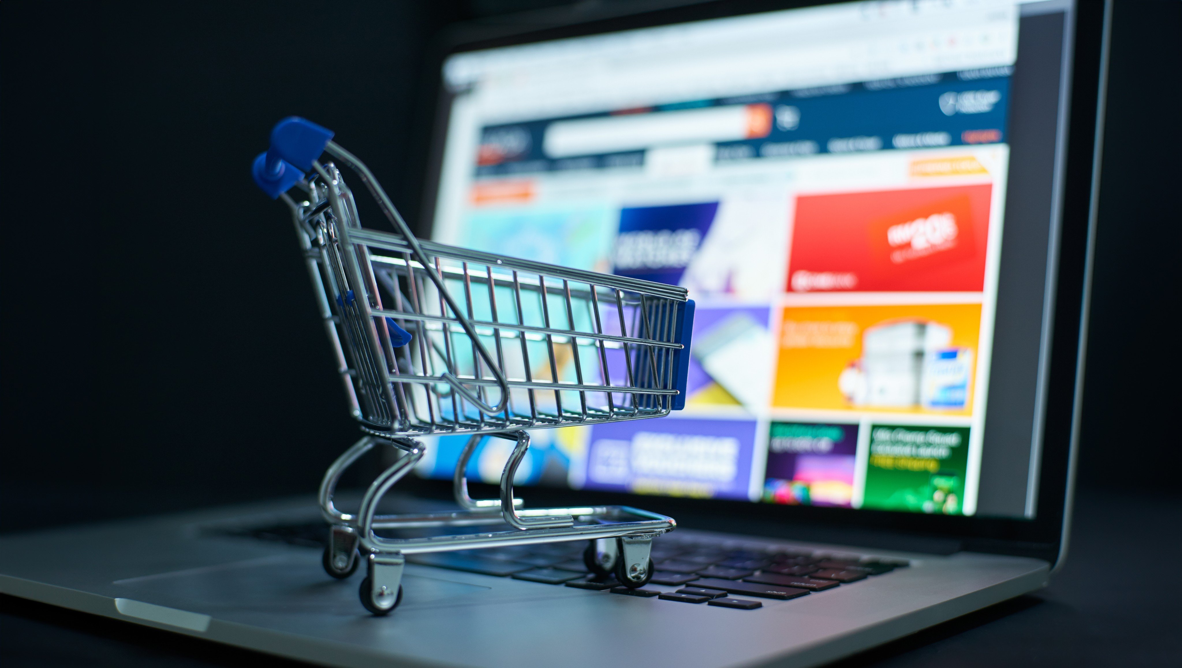 Shopping cart on laptop keyboard