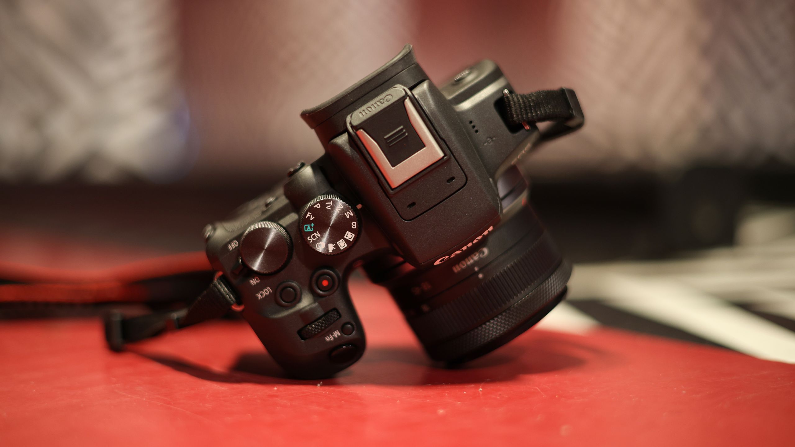 A Fujifilm X-series APS-C mirrorless camera on a surface, illustrating the brand's market dominance in Japan