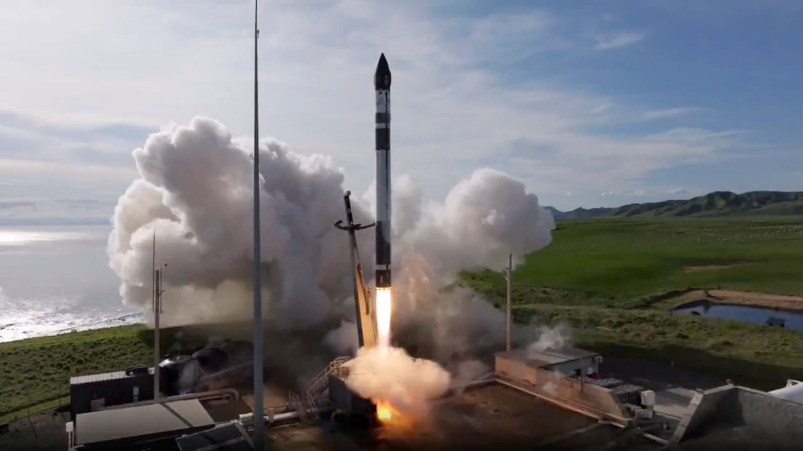 Rocket Lab's Electron rocket launching into space at night