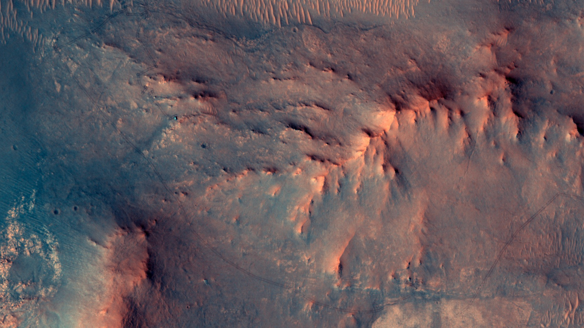 NASA's Mars Reconnaissance Orbiter captured Perseverance rover as a green speck on the Martian surface on June 13, 2026, marking the day before its marathon completion.