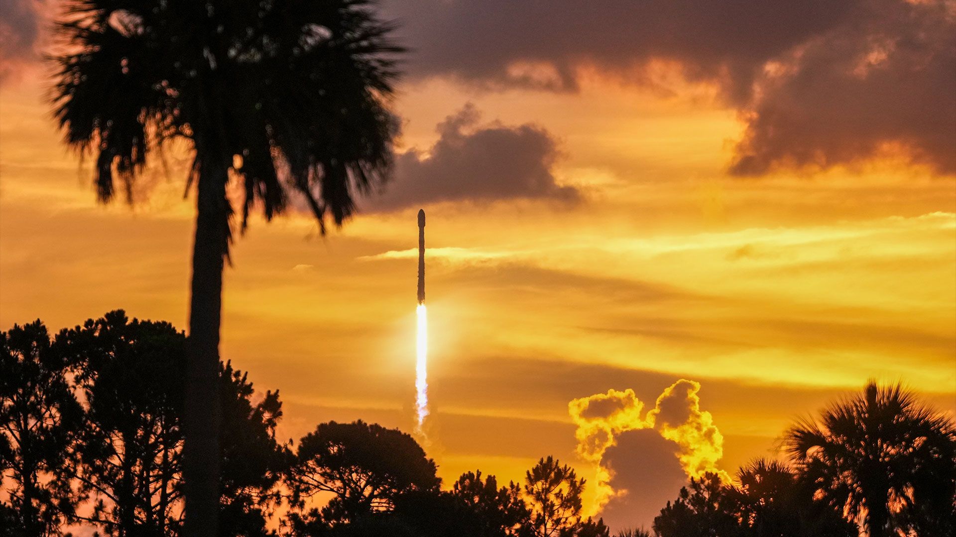 Two Falcon 9 rockets launching from opposite U.S. coasts in photographs from SpaceX mission control
