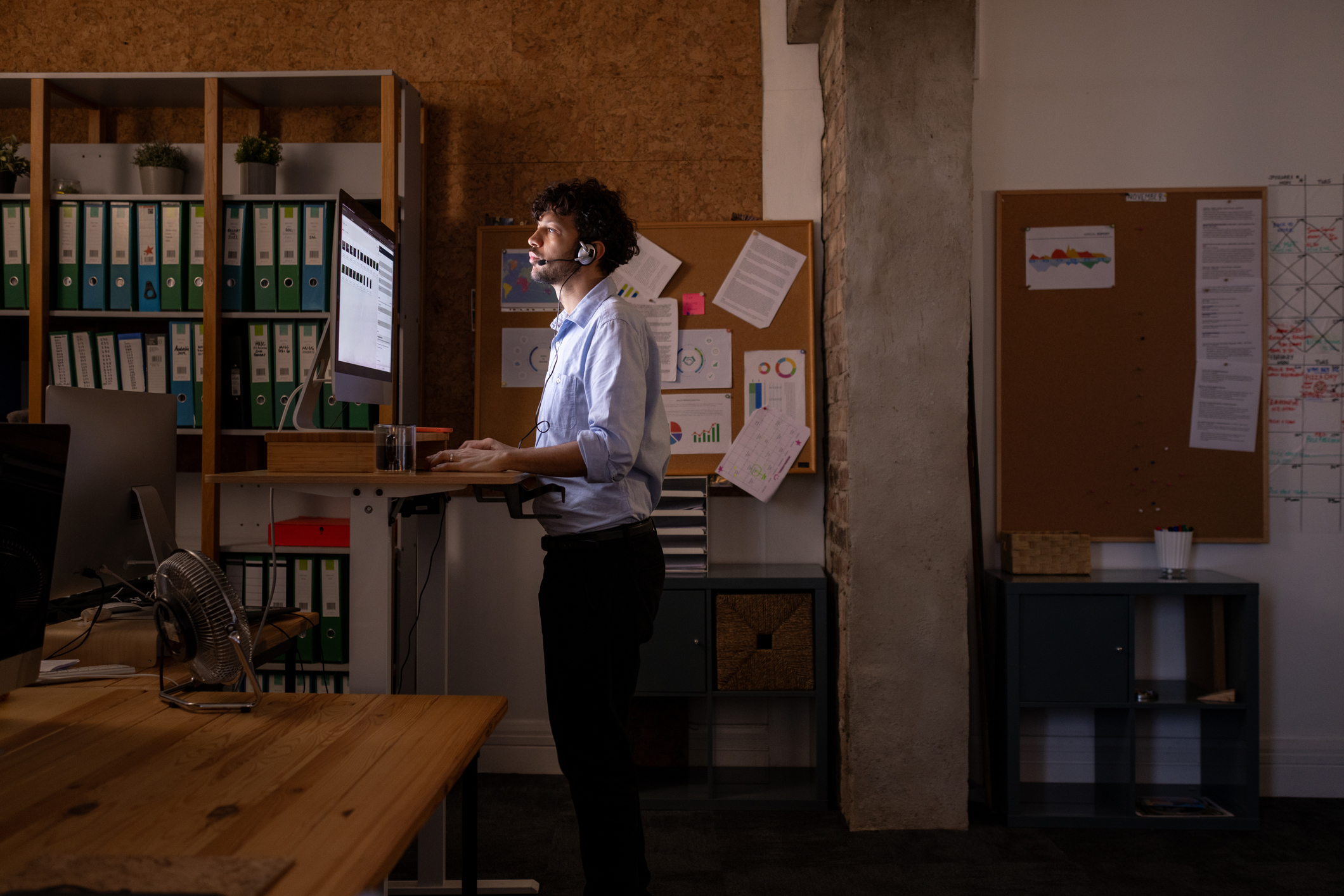 Workers in modern office setting collaborating on projects