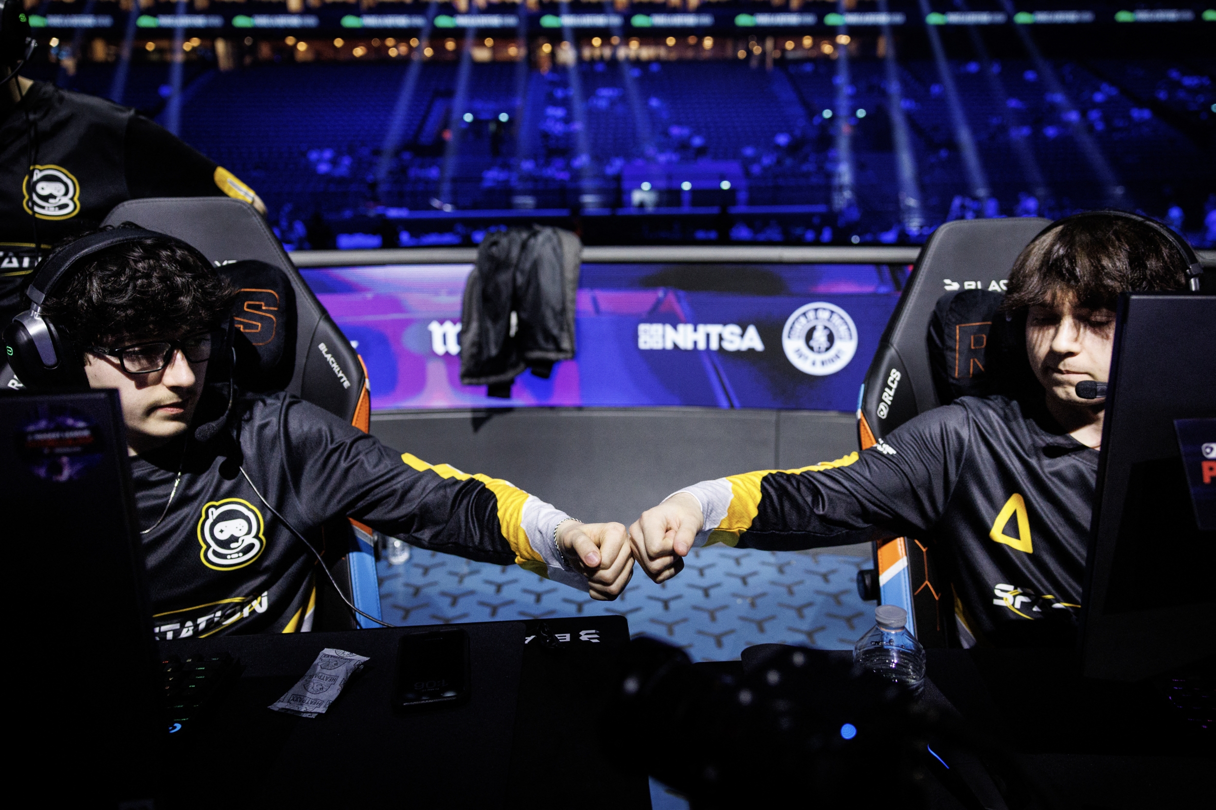 Team players fist bumping ahead of an esports competition