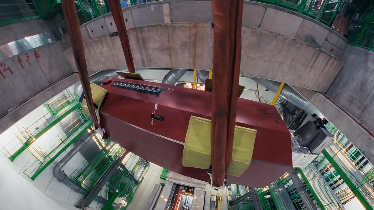 Video frame showing the extraction of heavy machinery from the LHC tunnel