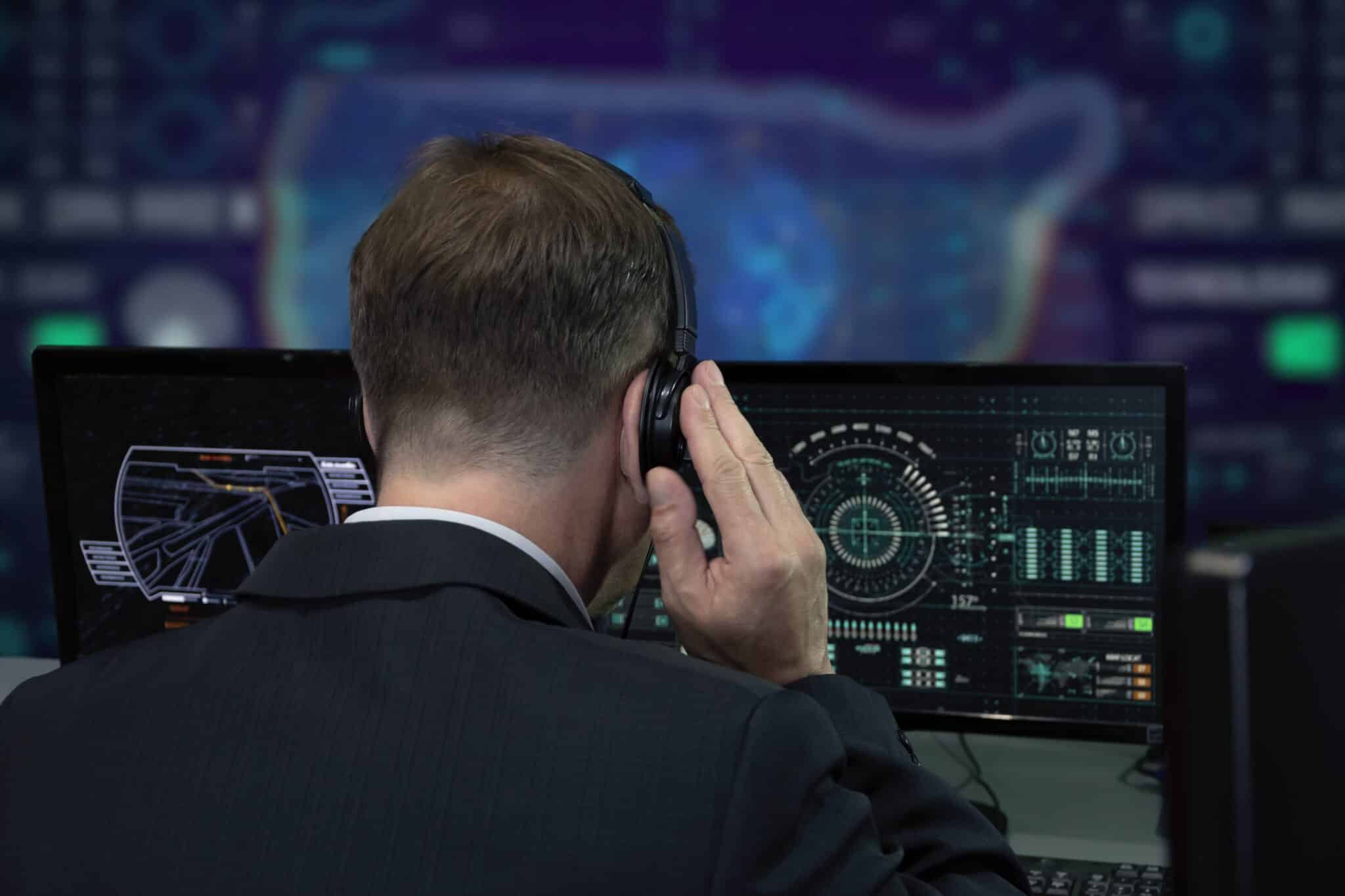 Military personnel using biometric surveillance equipment