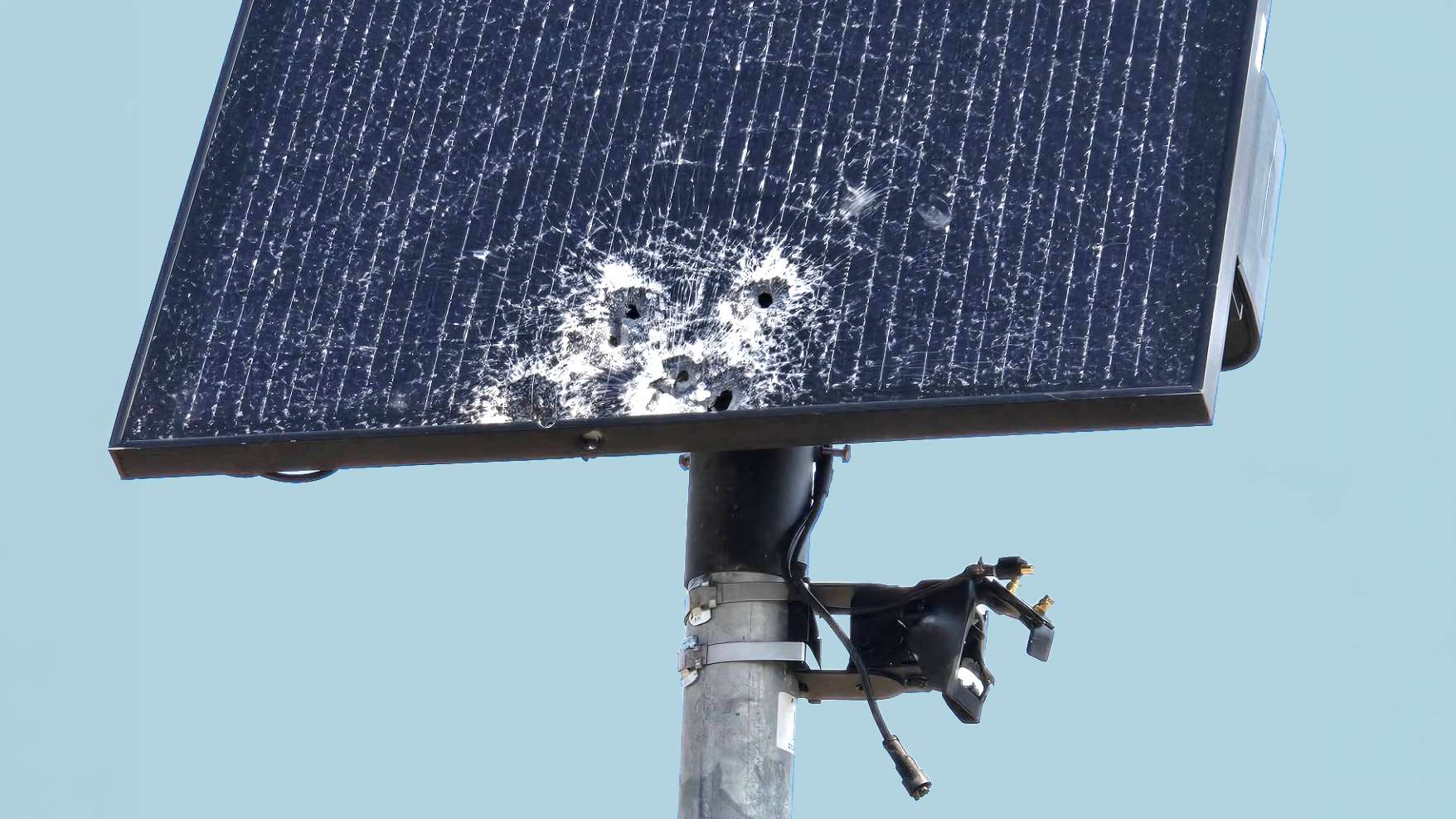 A damaged or tampered-with surveillance camera housing