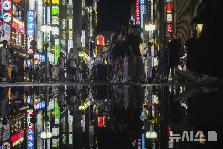 Shinjuku street scene with tourists