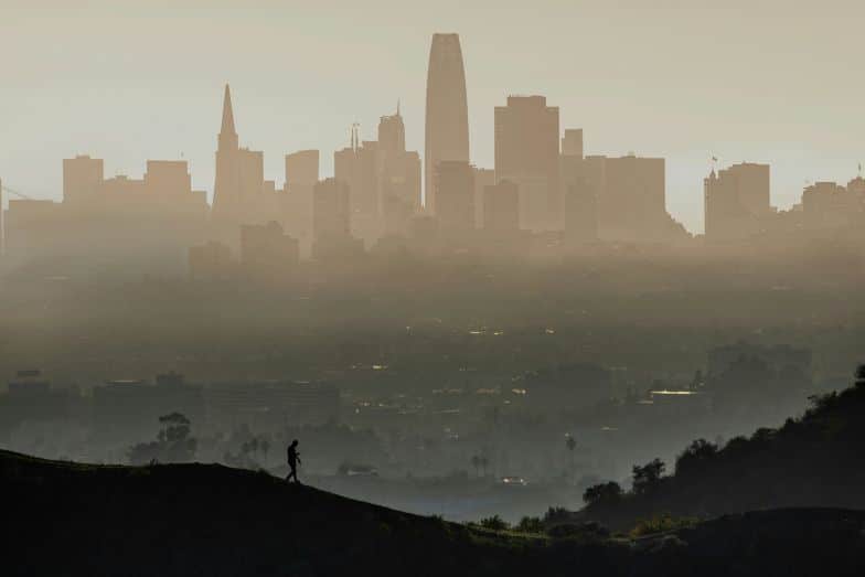 Smog covering a city skyline illustrating rising global temperatures