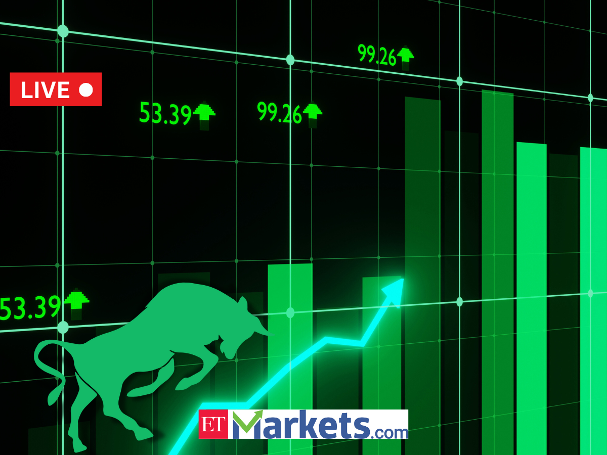 Indian stock market trading floor with digital display boards showing indices and live prices