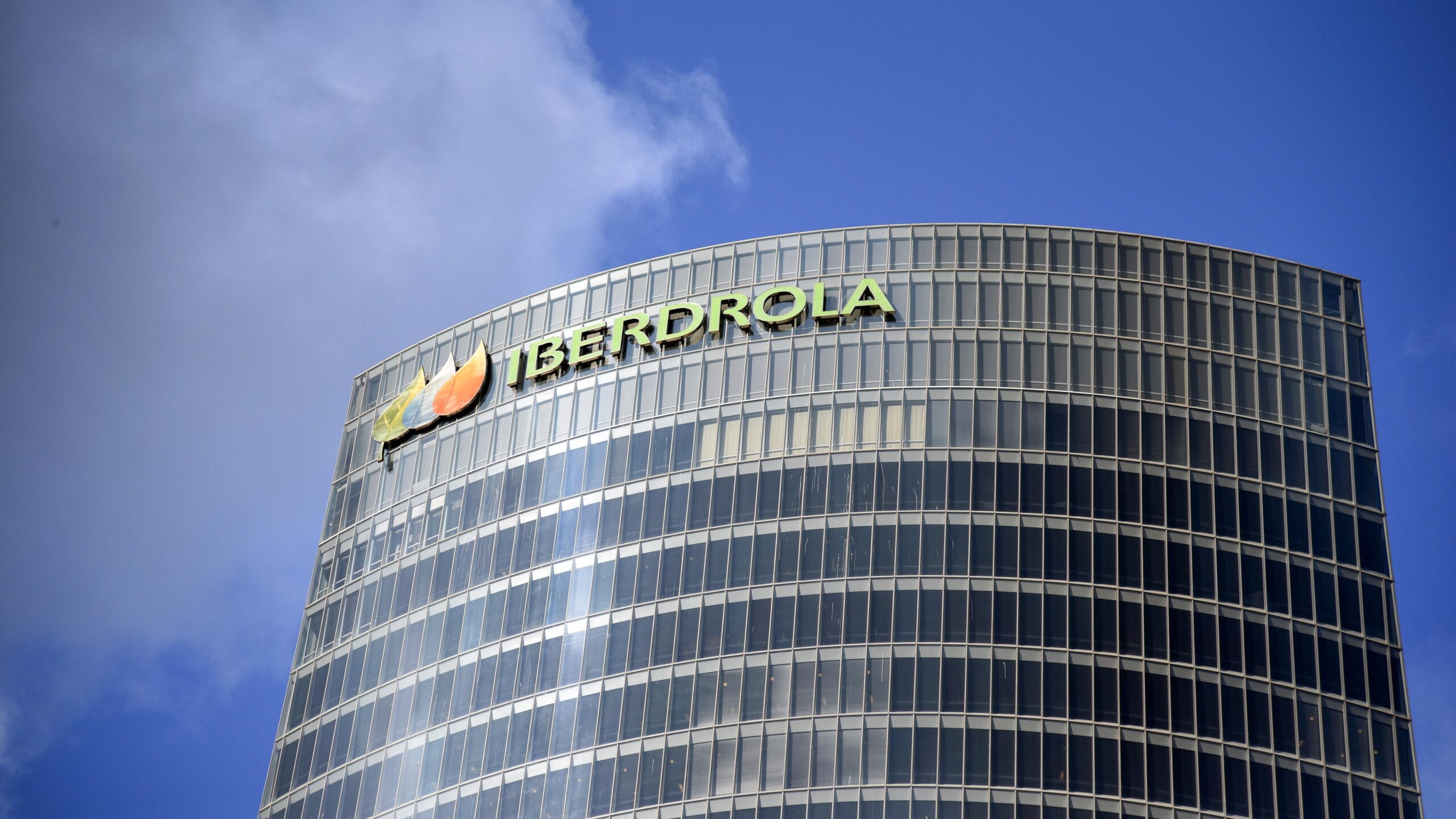 Iberdrola renewable energy facility with solar panels and wind turbines, illustrating green bond use of proceeds