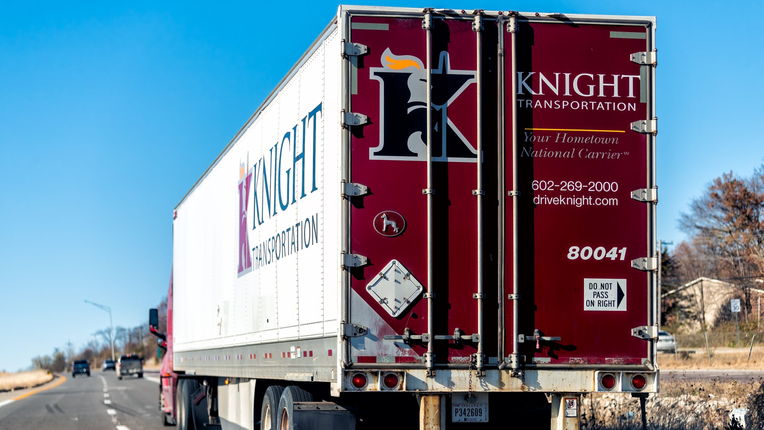 A Knight Transportation trailer being pulled on a highway