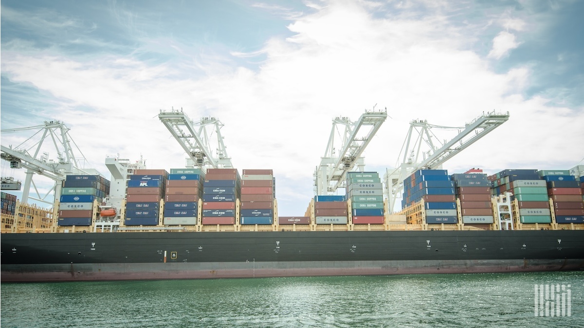 Aerial view of the Port of Los Angeles with container cranes and stacked boxes
