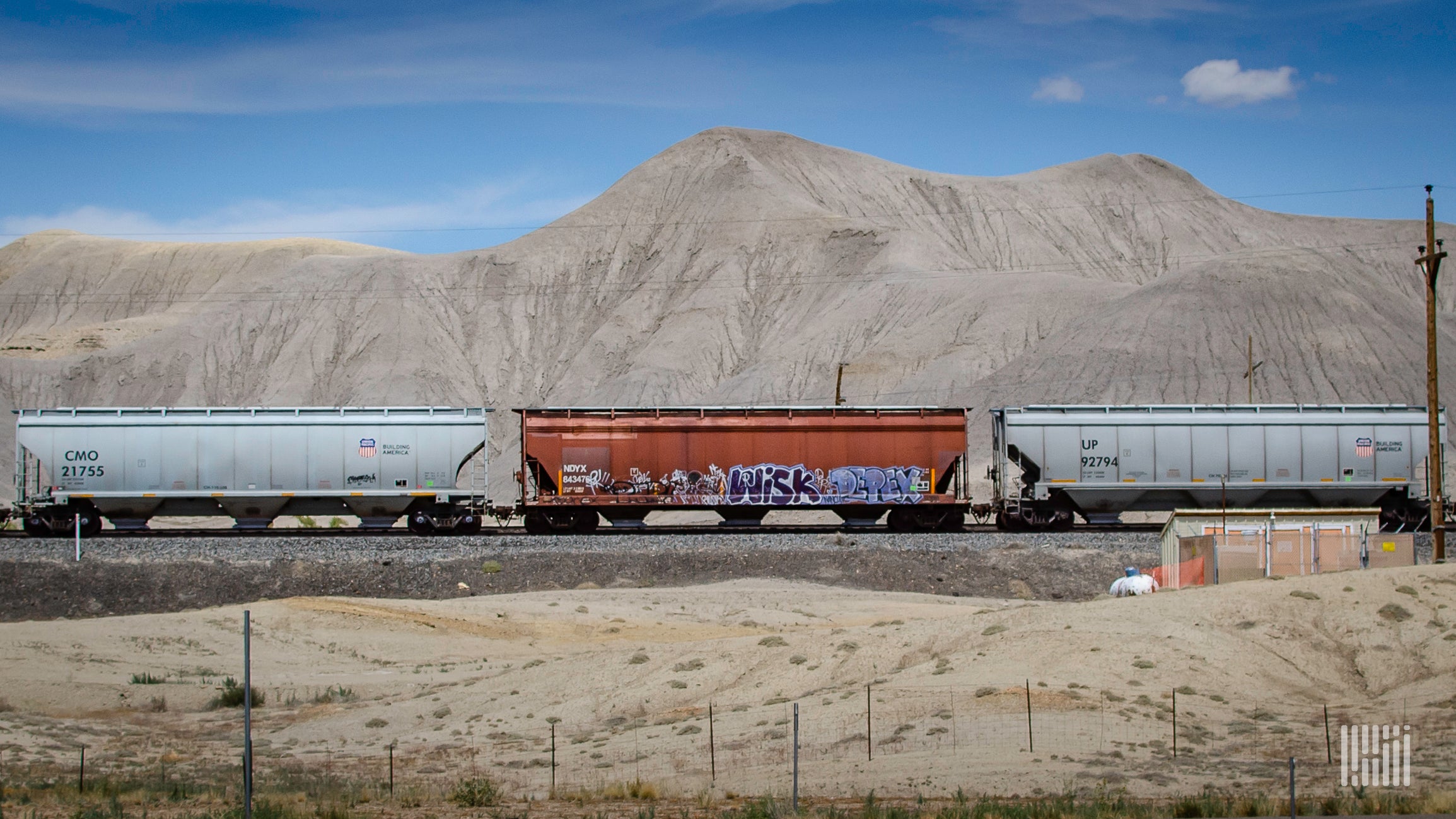 BNSF grain cars on rail line
