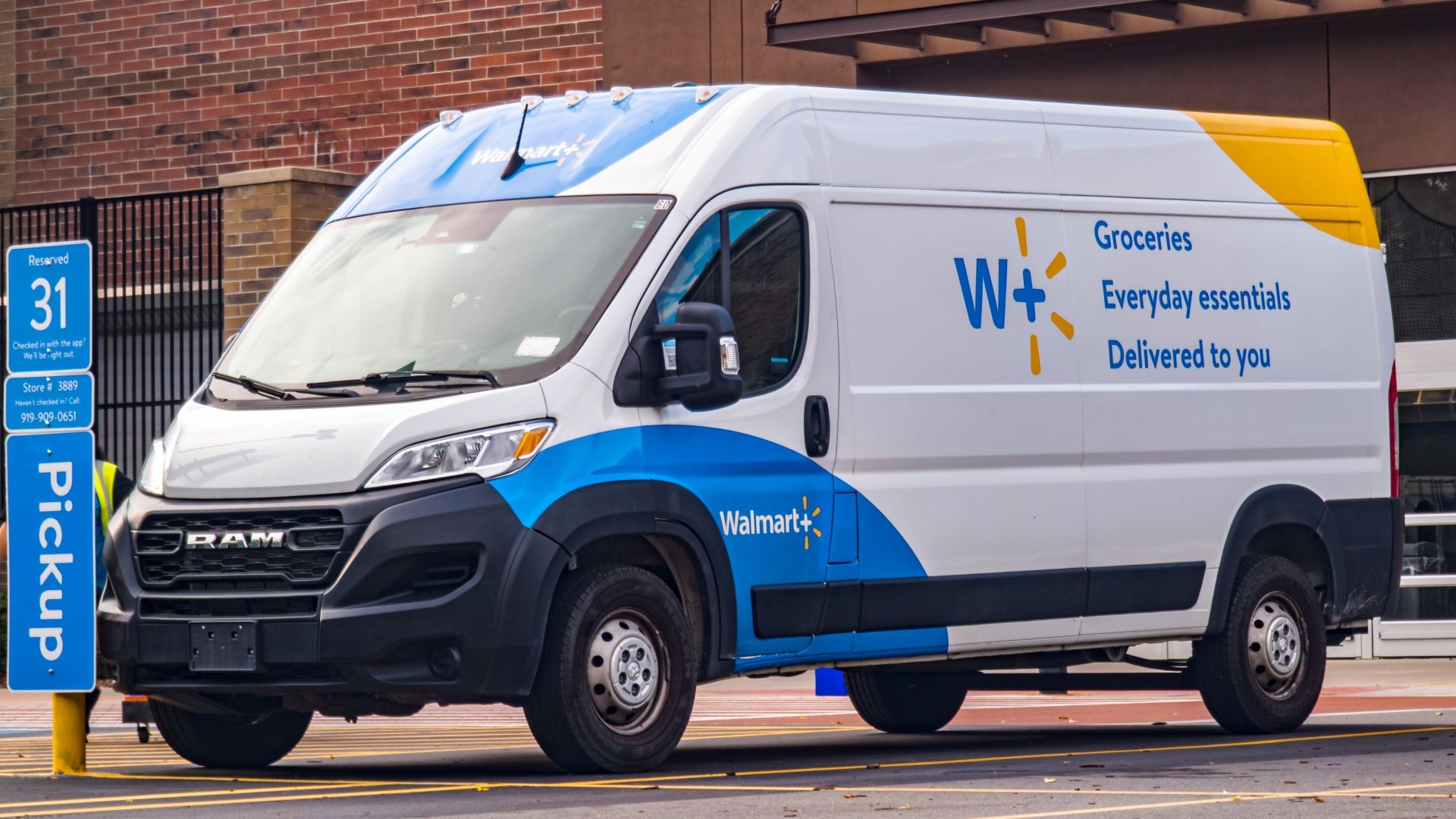 Walmart delivery van with blue and yellow accents