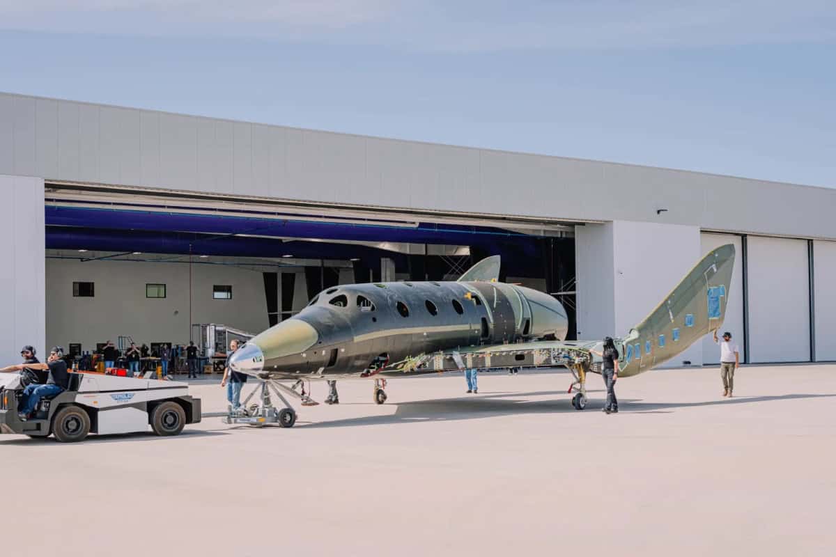 Virgin Galactic's new Delta-class spaceplane being towed during ground testing preparations