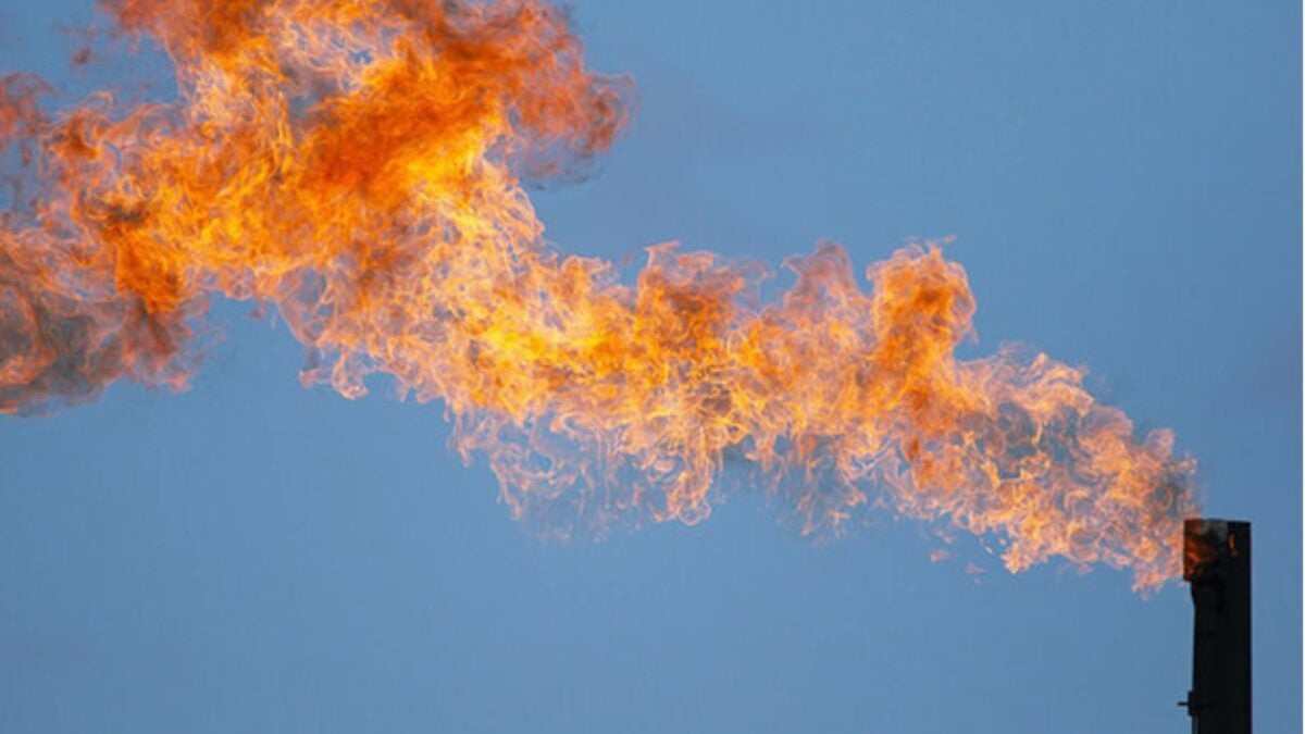 Flaring gas at an industrial facility, illustrating methane emissions