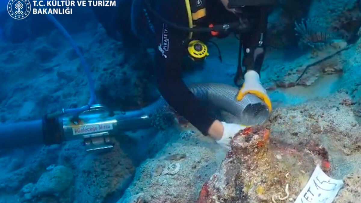 Diver studying amphorae at Kekova shipwreck