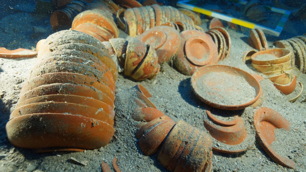 Close-up of intact Roman ceramic dishes recovered from the Mediterranean shipwreck, showing remarkable preservation