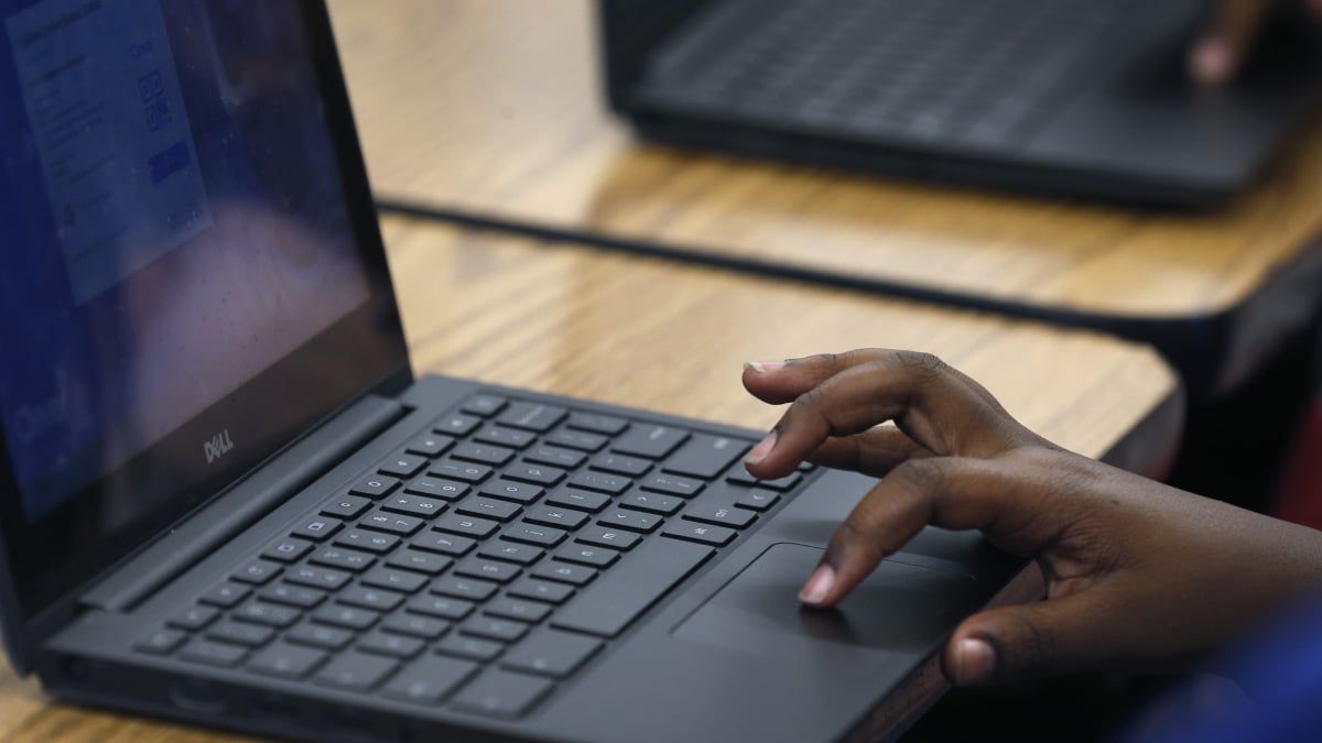 Illustration of students using tablets in a classroom