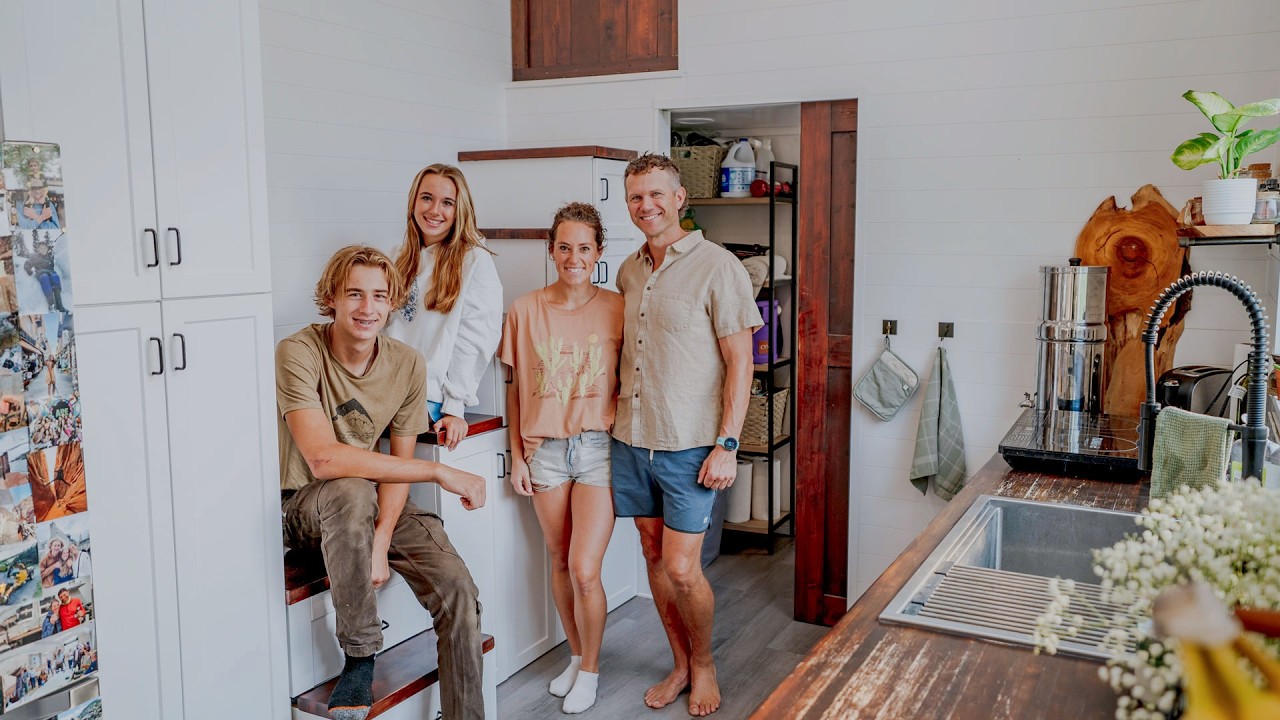 Interior view of a modern 3-bedroom tiny home showcasing bedroom privacy and efficient use of vertical space