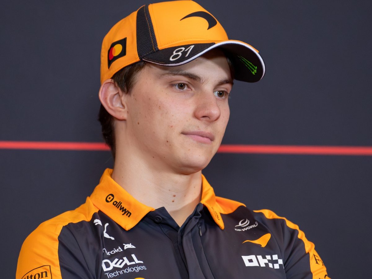 Oscar Piastri looking concerned in his McLaren cockpit