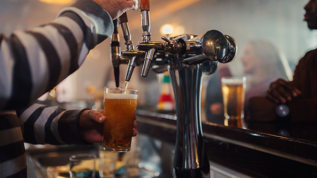 Bartender pouring craft beer in a Scottish pub