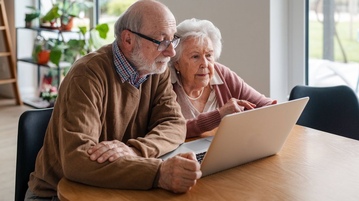State pensioners using a laptop, illustrating confusion over pension changes